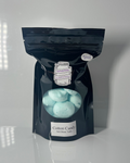 Black package of freeze dried salt water taffy on a white background 