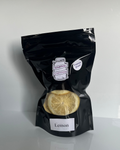 Black package of freeze dried lemon on a white background