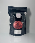Black package of freeze dried strawberries on a white background